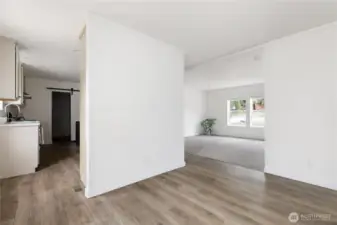 Dining room is open to the Kitchen, so perfect for entertaining, and Living room.  To the left before entering the kitchen is the back door.