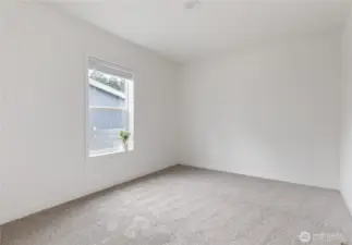 Bedroom #3.  Roomy with nice vaulted ceiling