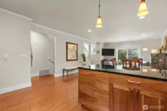 Kitchen opens up to the dining area in this wide layout.