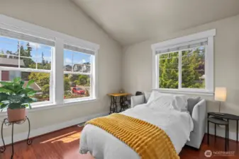 Second bedroom suite has soaring vaulted ceilings and plenty of daylight.