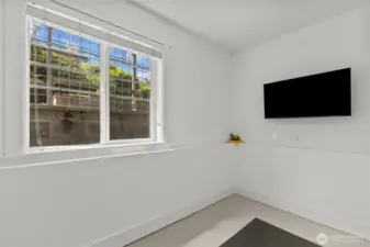 Office/den/exercise room on the entry level features a nice big window.