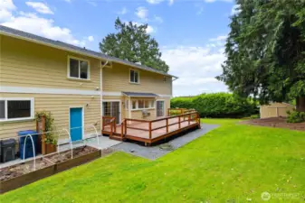 Backyard with deck and garden space.