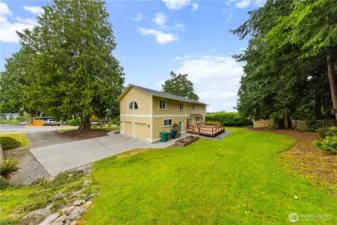 Lots of off street parking and a spacious 2 car garage. Park-like backyard and deck for outdoor enjoyment.