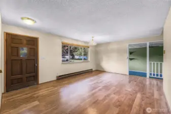 Main entry opens into large bright living room