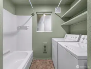 Full bath with laundry area