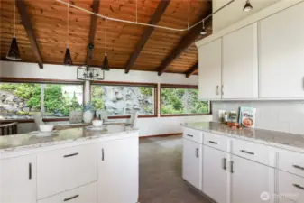 Looking from the kitchen toward the dining/living area and the view to the waterfall