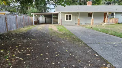 Lots of off-street parking available in front, including the paved driveway, gravel driveway, and large carport. Plenty of space for an RV.