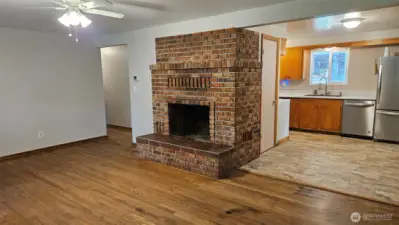Another view of the family room as it flows into the kitchen