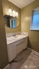 Main bathroom's lovely vanity cabinet/sink area