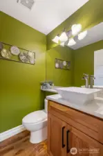 The updated 1/2 bath with quartz counters.