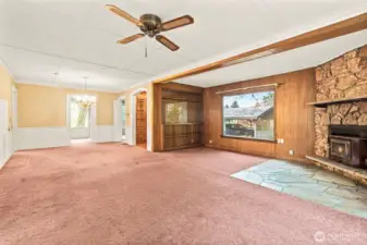 Spacious living room with wood burning fireplace. See renovation boards at house for ideas for a fresh look.