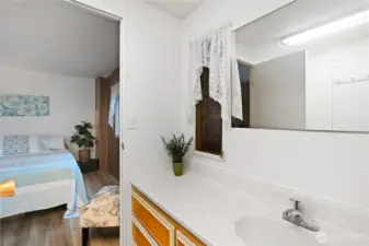 Guest bathroom opens to second bedroom
