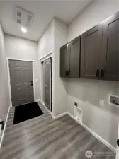 Laundry Room off of living room, leads into Garage