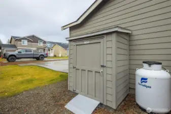 Storage shed on side of house