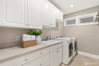 Laundry room on the main/entry level. This is one of three laundry hook ups. There is one in the Primary (north) closet and one in the storage room off the garage.