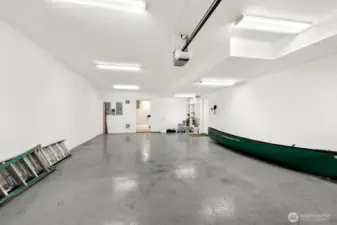 Attached four-car garage. You park two cars tandem, side-by-side. Note the storage and utility room at the back of the garage. Even more storage and the last laundry hook up!