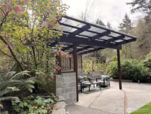The lanai has a new roof, and is ready to dazzle your guests with seating area and built in firepit!