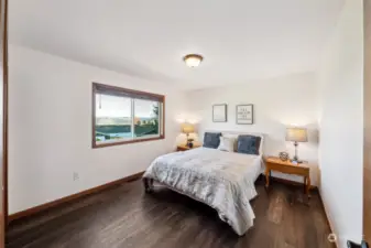Both upstairs bedrooms offer picturesque views of the mountain foothills.