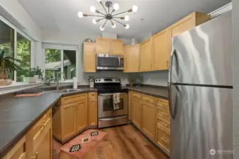 Kitchen has stainless steel appliances and ample storage space. New fixtures throughout!
