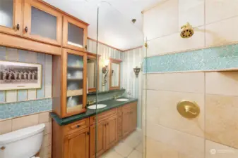 Bathroom features duel sinks and all new custom cabinetry with loads of storage