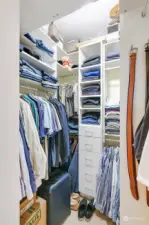 Marvelous custom wlk in closet has 9 ft ceilings with shelving all the way to the top, built in drawers, 6 hanging rods, and shelving for 24 pair of shoes