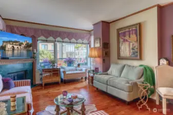 Another view of living room showing the crown molding and 9 ft ceilings perfect for your art collection