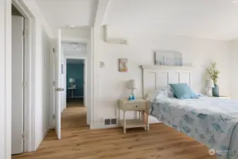 Looking at hallway into second bedroom .