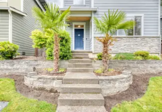 The welcoming covered front porch is adorned with knotty pine ceiling. HOA conveniently maintains all front yard landscaping.