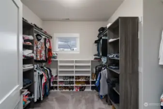 Wow! What a great primary closet with lots of natural light.