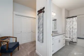 Upstairs hallway showing the full bath and closet space. Note this bath is very nicely sized with tile floor and solid surface countertop.