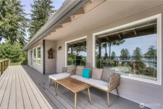 Further down the deck is access from the primary suite. So convenient for morning or evening relaxing...