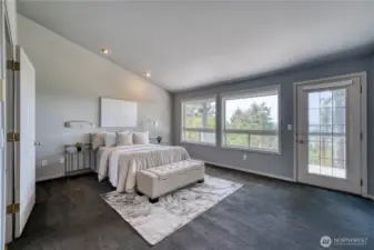 The primary bedroom not only has views, but also deck access.