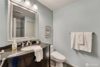Across from the second bedroom is the hall bath complete with a bidet (awesome) and a shower.