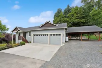 From driveway showing 3 car garage plus the 2 car carport.