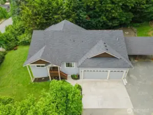 drone overhead of partial  lot. More property to right of home.