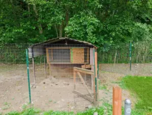 Chicken coop part of the property to right of carport.