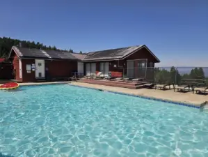 Beautiful outdoor swimming pool just down the road from your cabin in the woods...