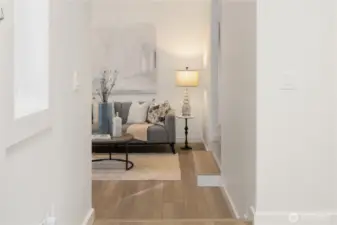 Living room features east facing bay windows, lots of natural morning light.