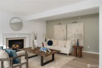 Spacious casual room with gas fireplace adjoins the gourmet kitchen with a wall of west facing windows to capture the view of the lake.