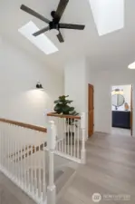 Skylights fill the second floor landing with natural light.