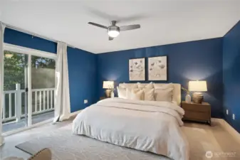 Primary suite with 5-piece ensuite bath and generous walk-in closet overlooks the glistening lake to the west.