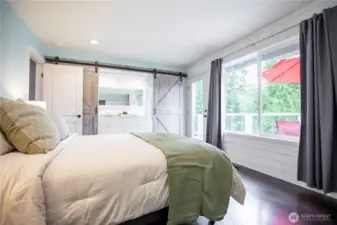 Primary bedroom with deck access.