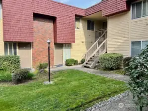 Unit #84  QUIET End Unit, Ground Level with private patio & Green area next to patio!