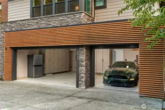 Fully finished 3 car garage with custom cabinetry and heat pump.