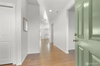 Large entry with built-in bench and closet to left.