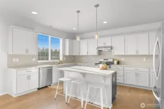 Quartz and painted cabinetry. New dishwasher.