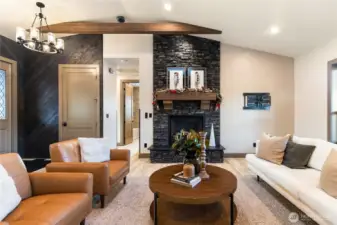 Living room with floor to ceiling brick fireplace