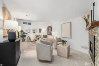 The lower level family room offers a cozy gas fireplace and rare vaulted ceilings