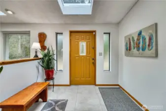 Welcoming entry way is a spacious place to get in from the weather.