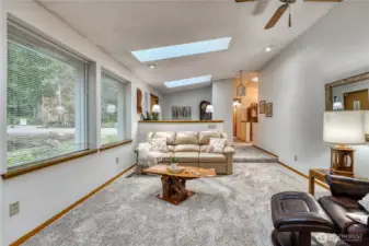 Family room has vaulted ceiling, new skylights, new carpet and newer windows making it light and bright.